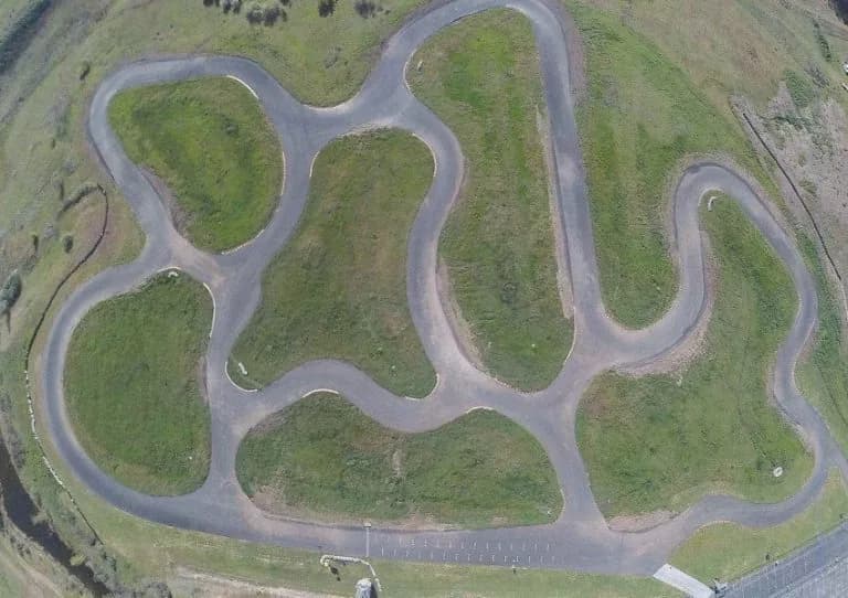 Supplied aerial photograph of a paved karting circuit, used as a reference for the motorsport concept